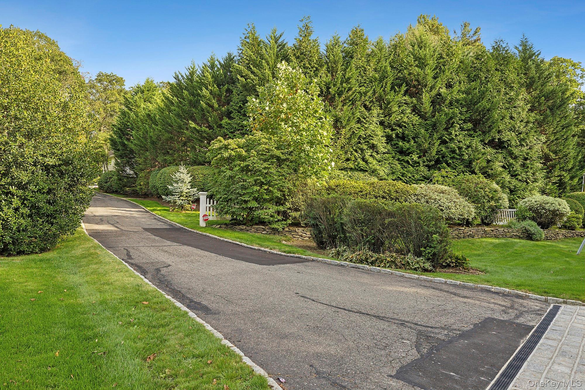 144 Round Swamp Road Huntington, NY 11743 - Photo 6 of 39 a view of a road with a yard