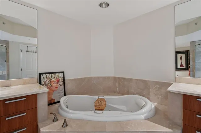 a bathroom with a tub and sink