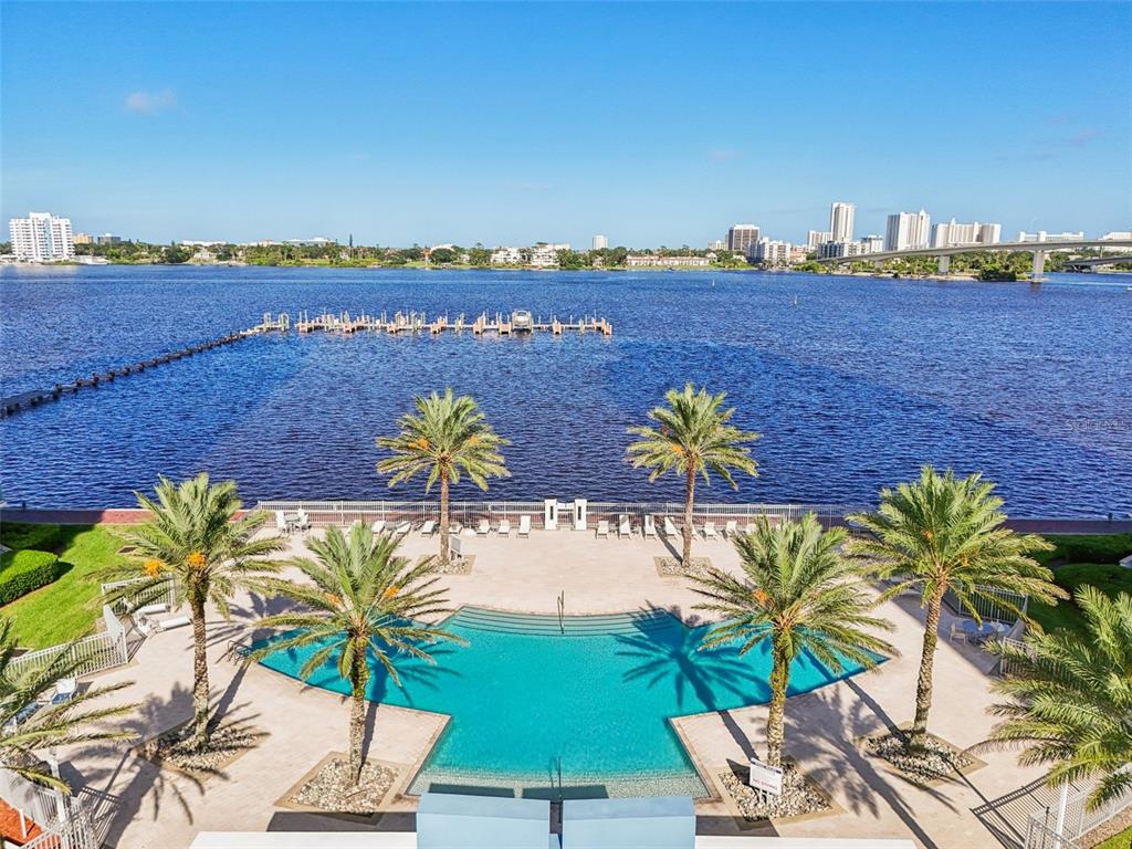 241 Riverside Drive, Unit 305 Daytona Beach, FL 32117 - Photo 2 of 35 a view of a lake with a mountain in the background