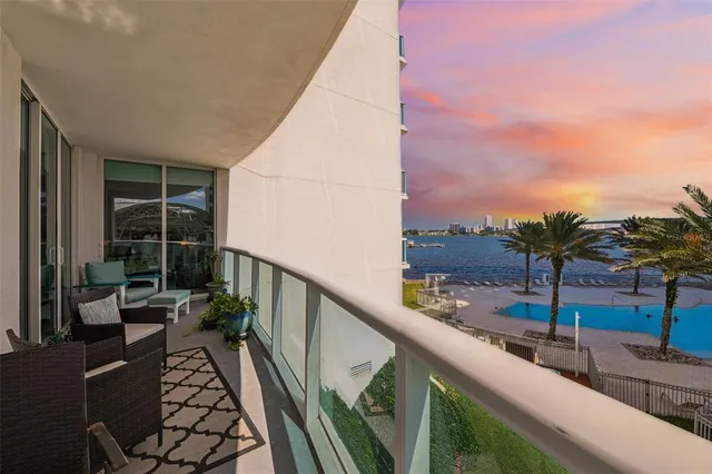 a balcony with view of potted plants