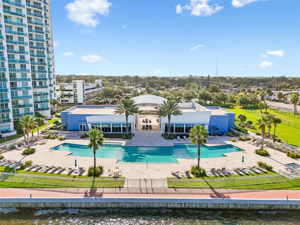241 Riverside Drive, Unit 305 Daytona Beach, FL 32117 - Photo 22 of 35 a front view of houses with yard