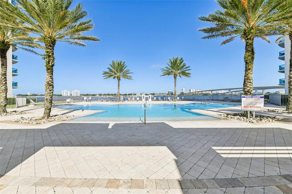 241 Riverside Drive, Unit 305 Daytona Beach, FL 32117 - Photo 23 of 35 a view of a backyard with palm trees