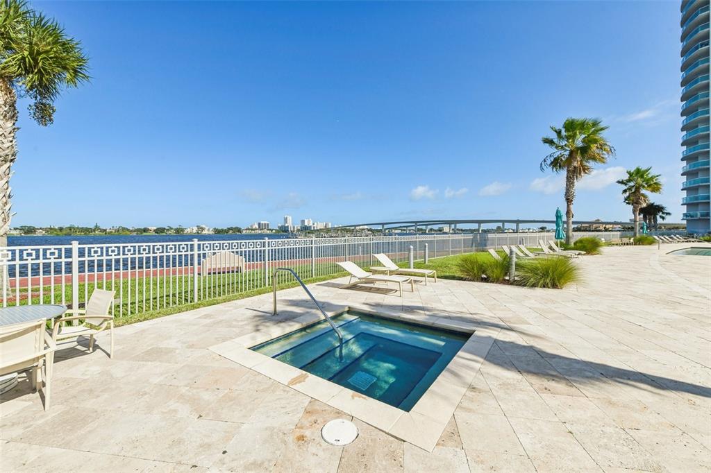 241 Riverside Drive, Unit 305 Daytona Beach, FL 32117 - Photo 24 of 35 a view of a swimming pool and an outdoor seating