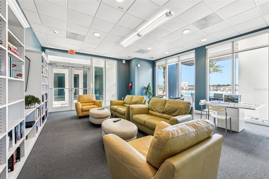 241 Riverside Drive, Unit 305 Daytona Beach, FL 32117 - Photo 26 of 35 a living room with furniture and a large window