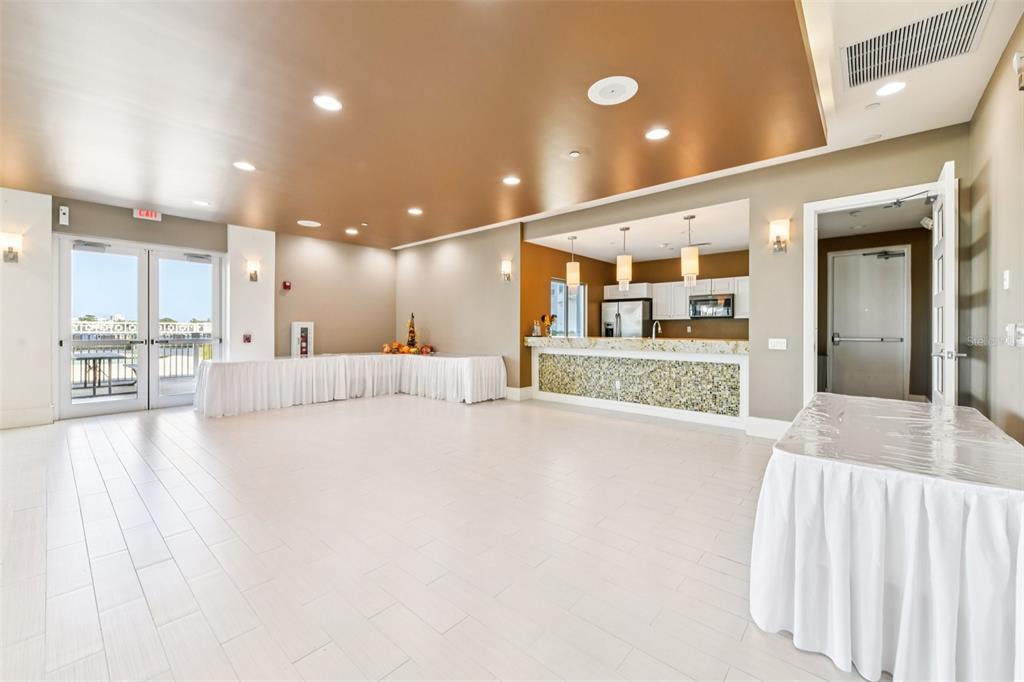 241 Riverside Drive, Unit 305 Daytona Beach, FL 32117 - Photo 30 of 35 a large hall with a large window and furniture