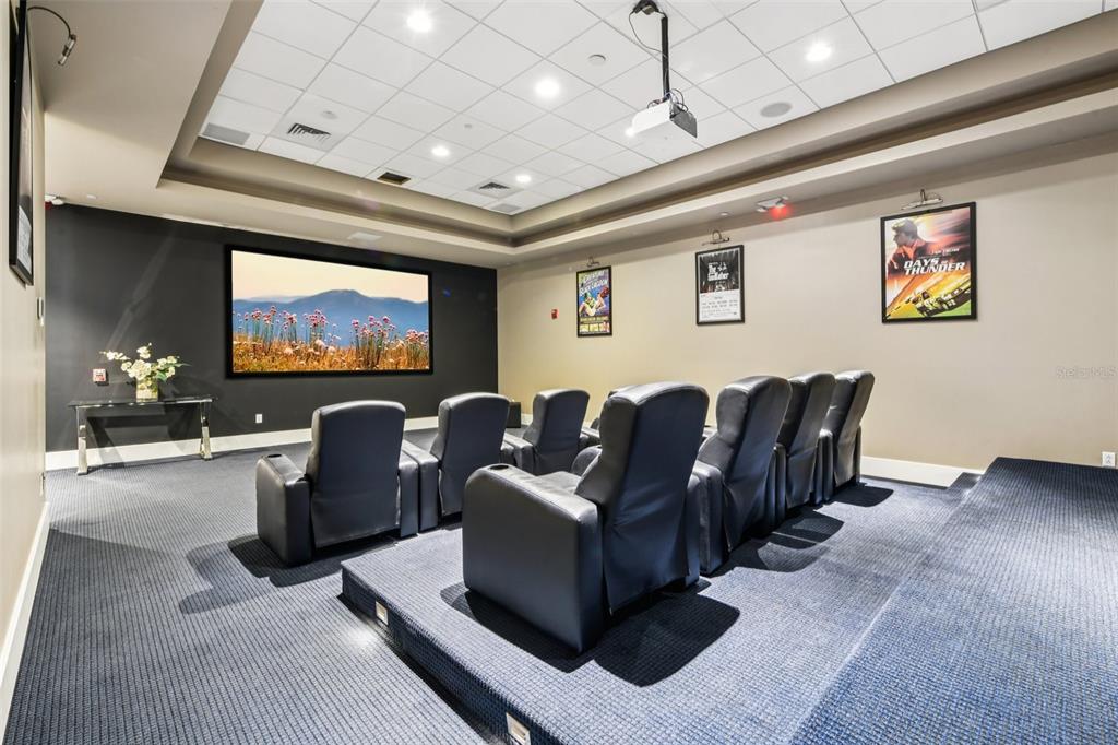 241 Riverside Drive, Unit 305 Daytona Beach, FL 32117 - Photo 33 of 35 a living room with couches a flat screen tv and kitchen view
