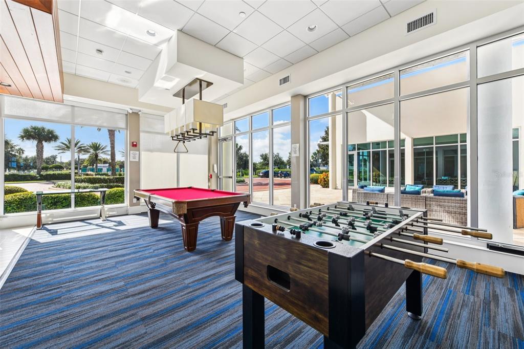 241 Riverside Drive, Unit 305 Daytona Beach, FL 32117 - Photo 34 of 35 a living room with furniture and a wooden floor