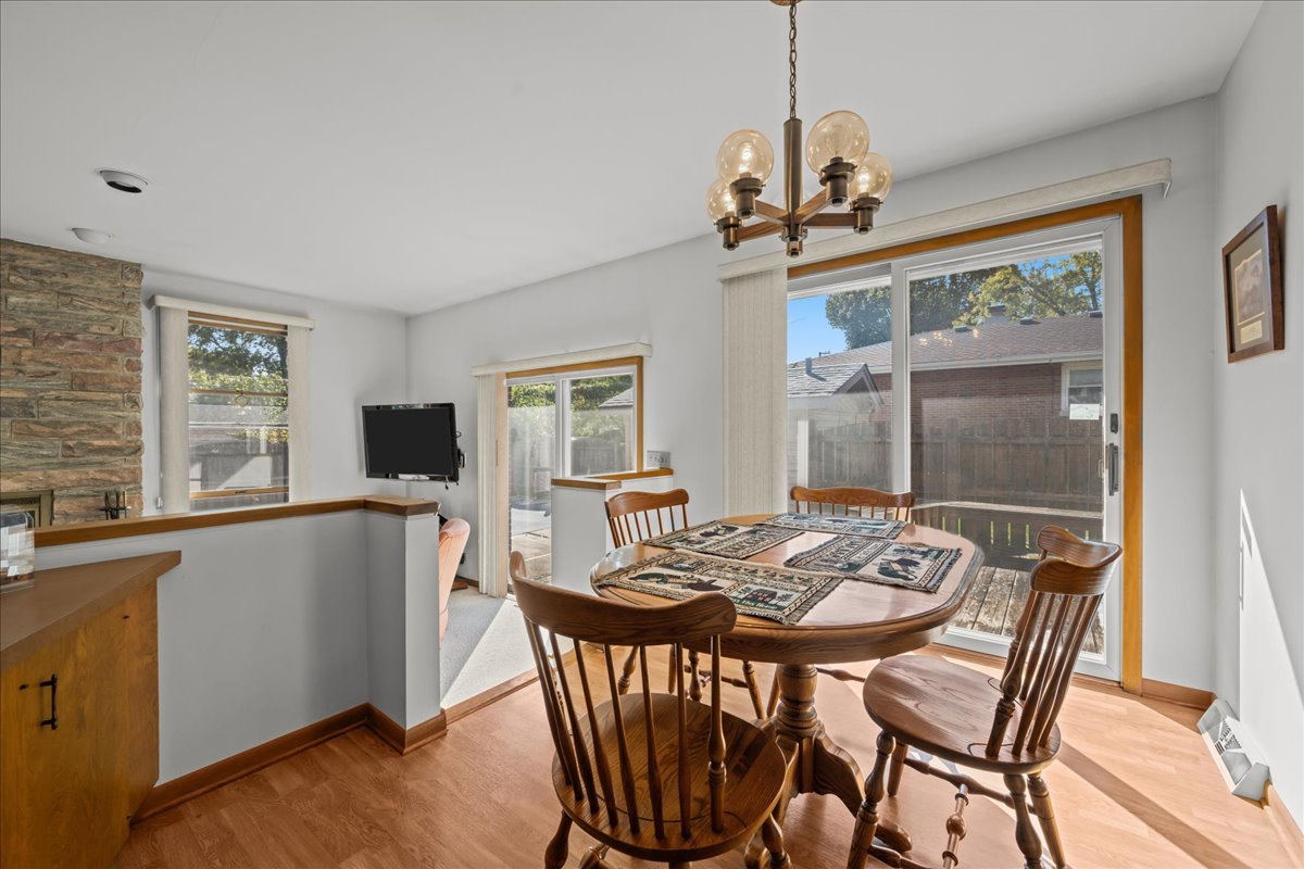 328 West State Street North Aurora, IL 60542 - Photo 15 of 31 a view of a dining room with furniture window and wooden floor