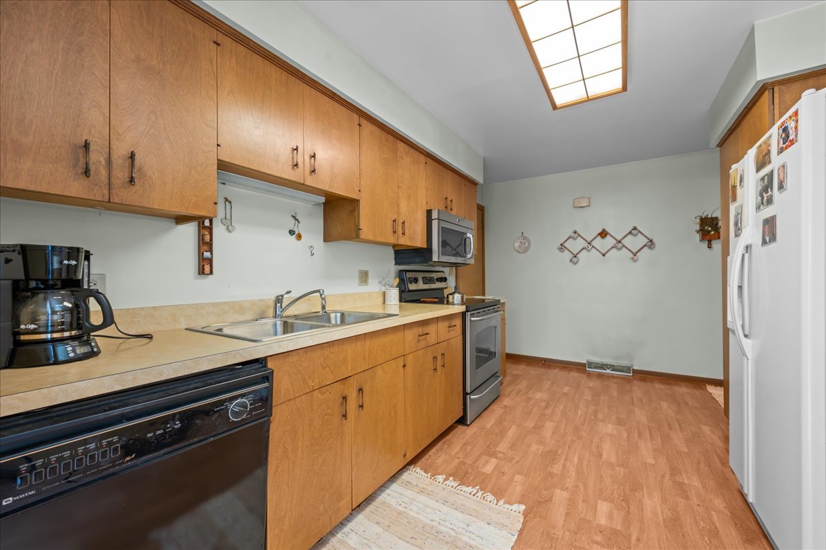 328 West State Street North Aurora, IL 60542 - Photo 16 of 31 a kitchen with a sink a stove and cabinets