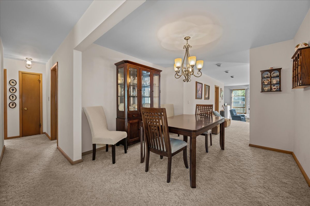 328 West State Street North Aurora, IL 60542 - Photo 7 of 31 a view of a dining room with furniture and chandelier