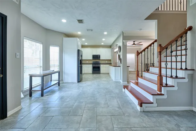 a view of kitchen with furniture and windows