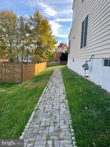 a view of a pathway with a yard