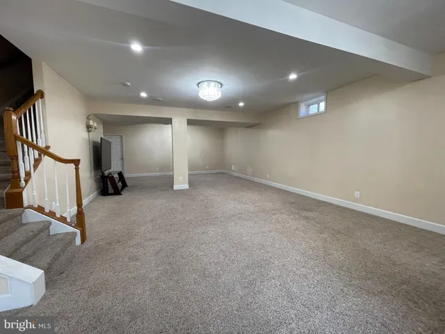 an empty room with gym equipment and white walls
