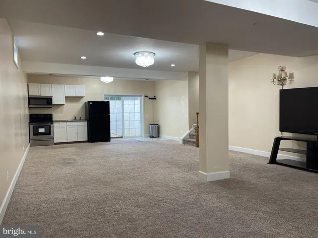 a view of livingroom with furniture and flat screen tv