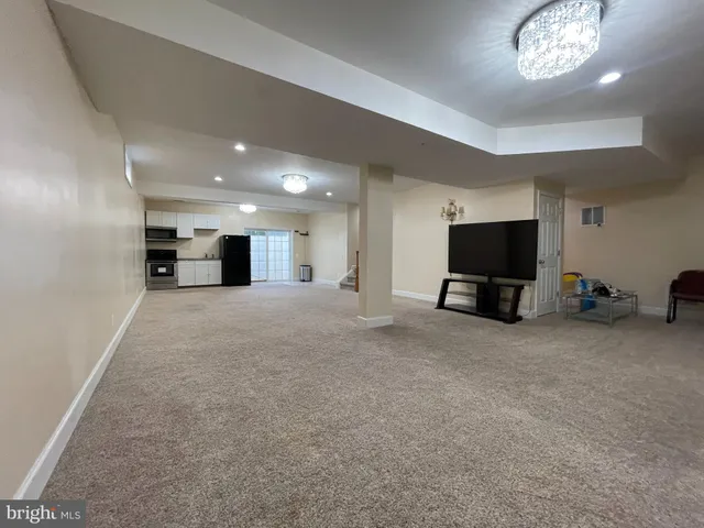 a view of empty room with a flat screen tv