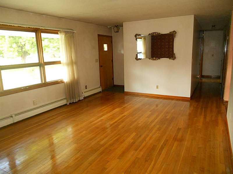 78 East Franklin Road Mercer, PA 16137 - Photo 4 of 19 Living Room. Living Room with Beautiful Hardwood Flooring and a Large Window providing natural lighting