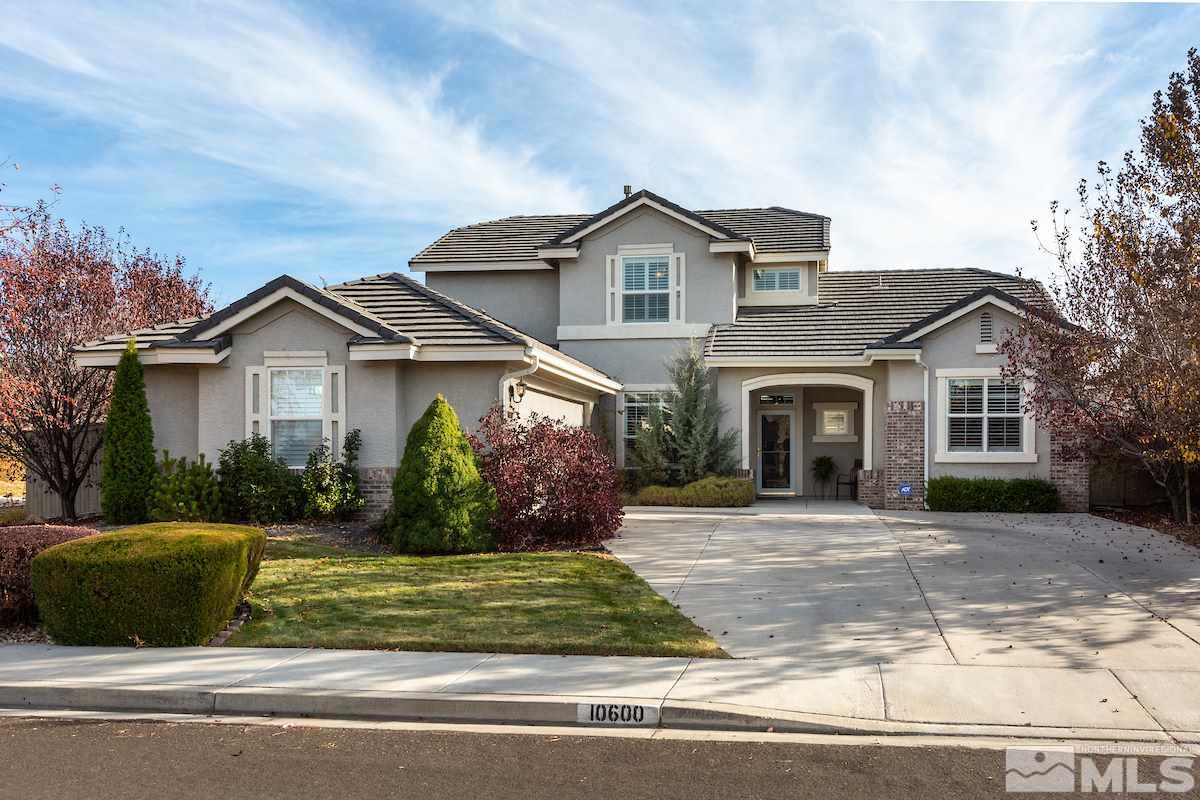 10600 Sterling Ridge Way Reno, NV 89521 - Photo 1 of 25 a front view of a house with a yard and garage