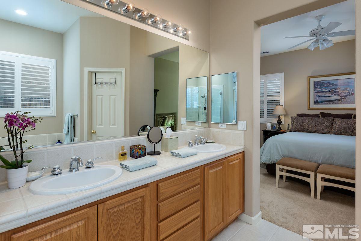 10600 Sterling Ridge Way Reno, NV 89521 - Photo 13 of 25 a en suite bathroom with sink and mirror