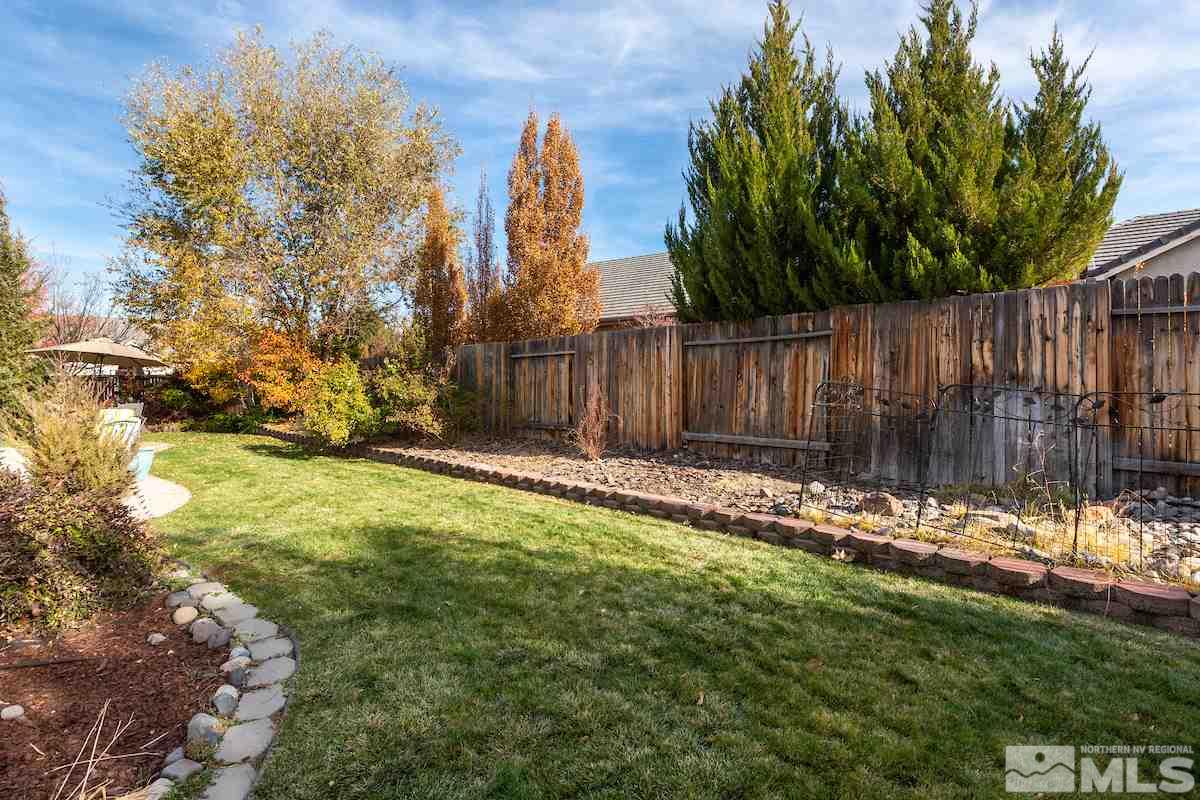 10600 Sterling Ridge Way Reno, NV 89521 - Photo 23 of 25 a view of a backyard with wooden fence