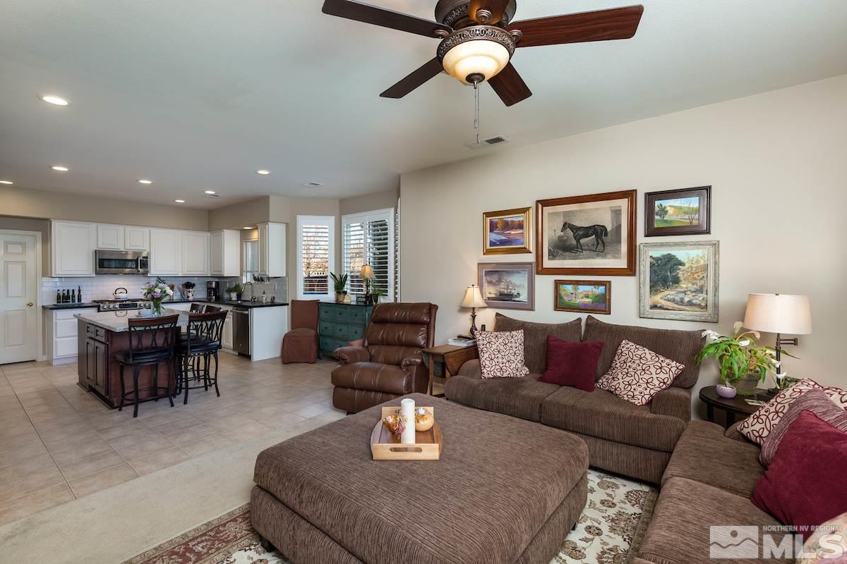 10600 Sterling Ridge Way Reno, NV 89521 - Photo 8 of 25 a living room with furniture kitchen view and a wooden floor