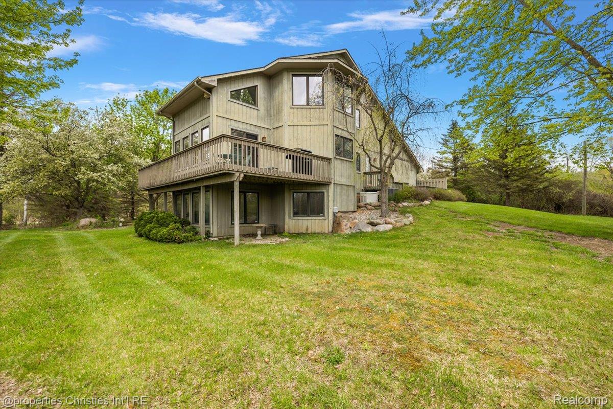 6175 Tripp Road Holly, MI 48442 - Photo 40 of 63 Multi-level exterior with a wood-sided finish