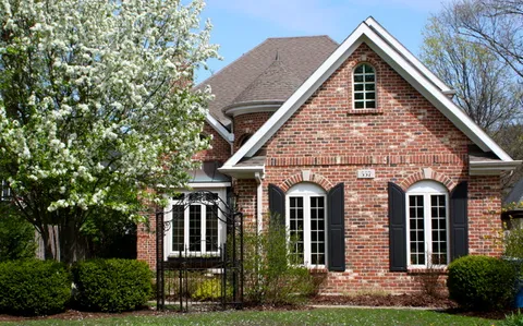 front view of a house with a yard