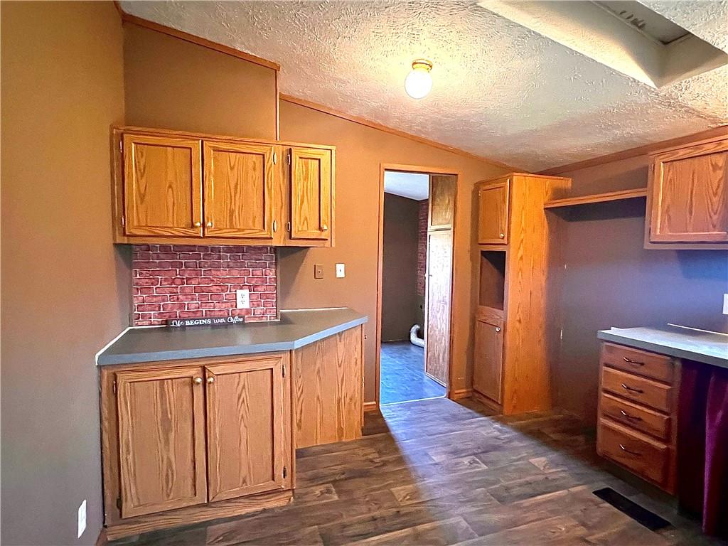 151 Crum Road Bessemer, PA 16112 - Photo 5 of 16 a kitchen with stainless steel appliances granite countertop a stove and a refrigerator
