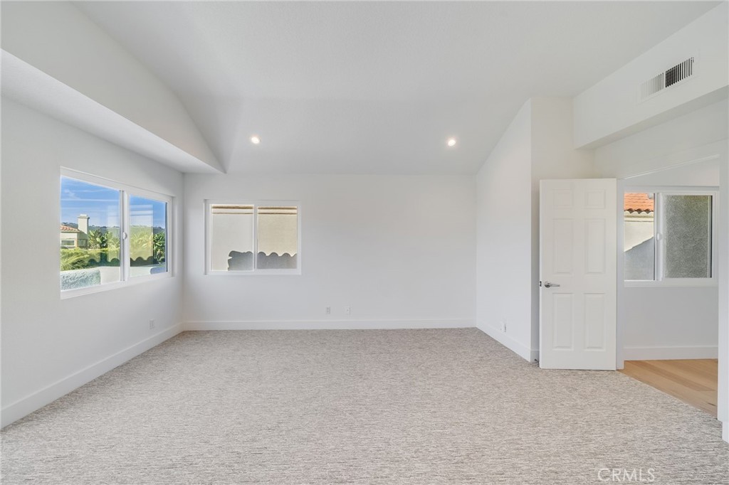 25 St John Dana Point, CA 92629 - Photo 9 of 17 an empty room with windows and entrance