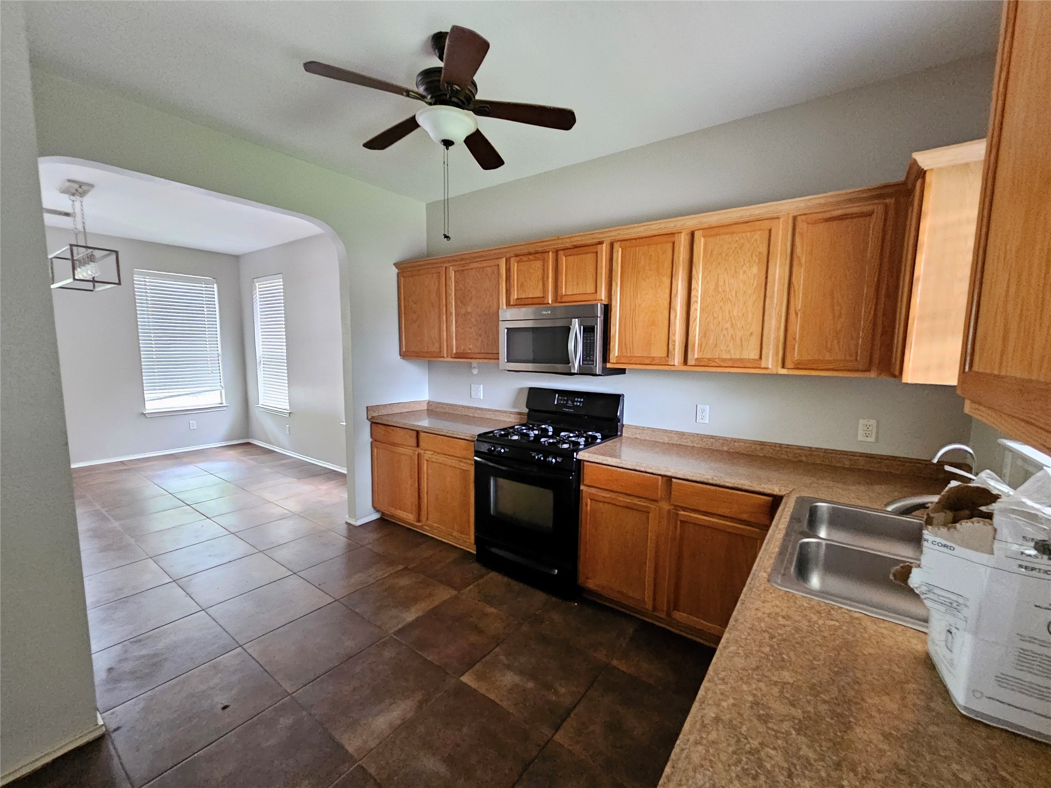 4672 Mather Kyle, TX 78640 - Photo 10 of 28 a kitchen with a sink appliances cabinets and a window