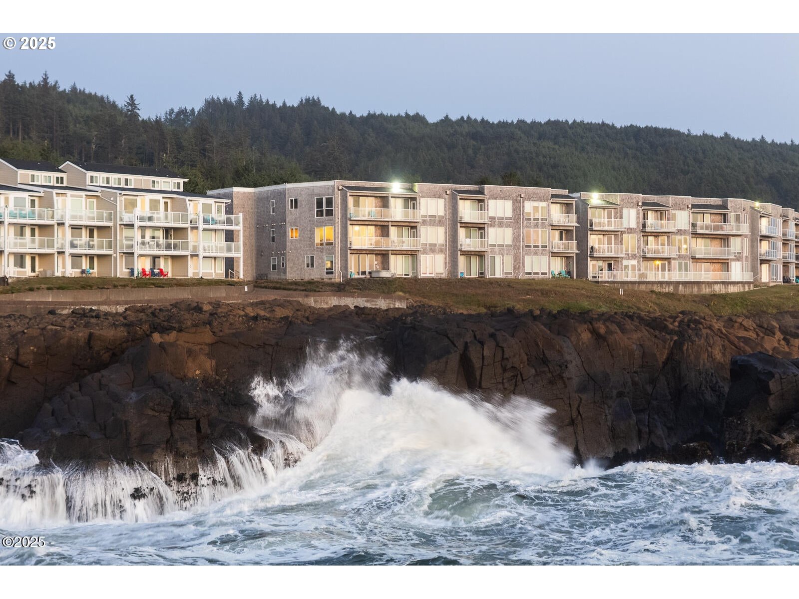 1113 Highway 101, Unit 48 Depoe Bay, OR 97341 - Photo 1 of 40 a view of swimming pool and mountain