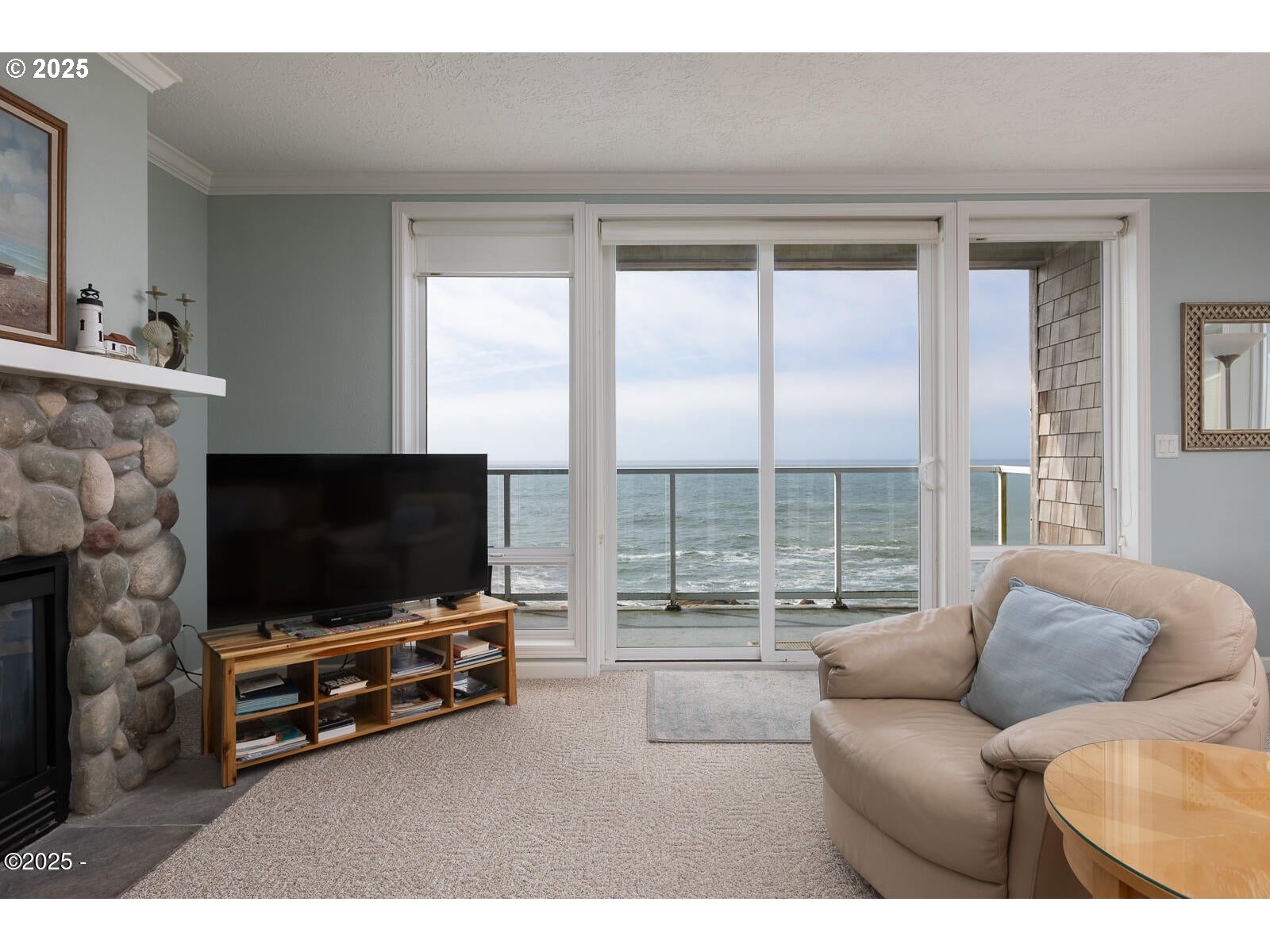1113 Highway 101, Unit 48 Depoe Bay, OR 97341 - Photo 11 of 40 a living room with furniture and a flat screen tv