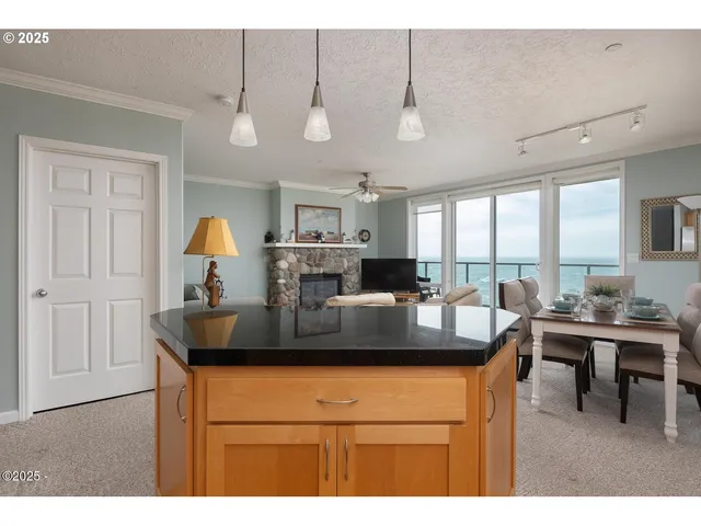 a kitchen with a dining table and chairs