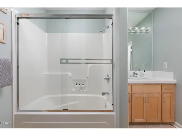 a bathroom with a bathtub and a sink