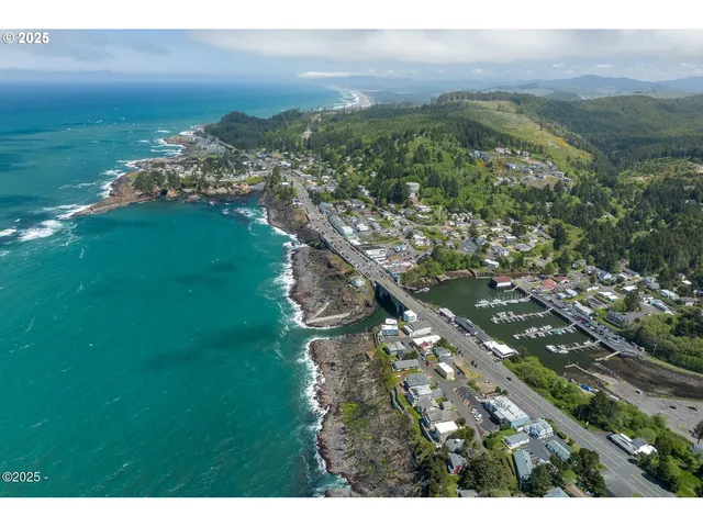 a aerial view of a houses with a yard