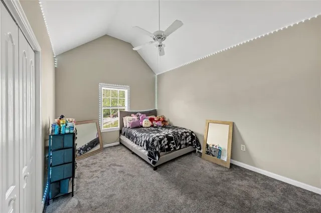 a bed room with a bed and a window