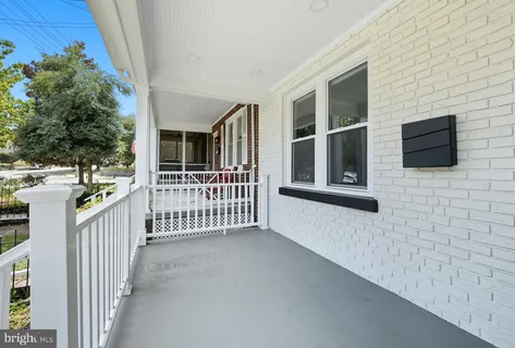 a view of a house with porch and wooden floor
