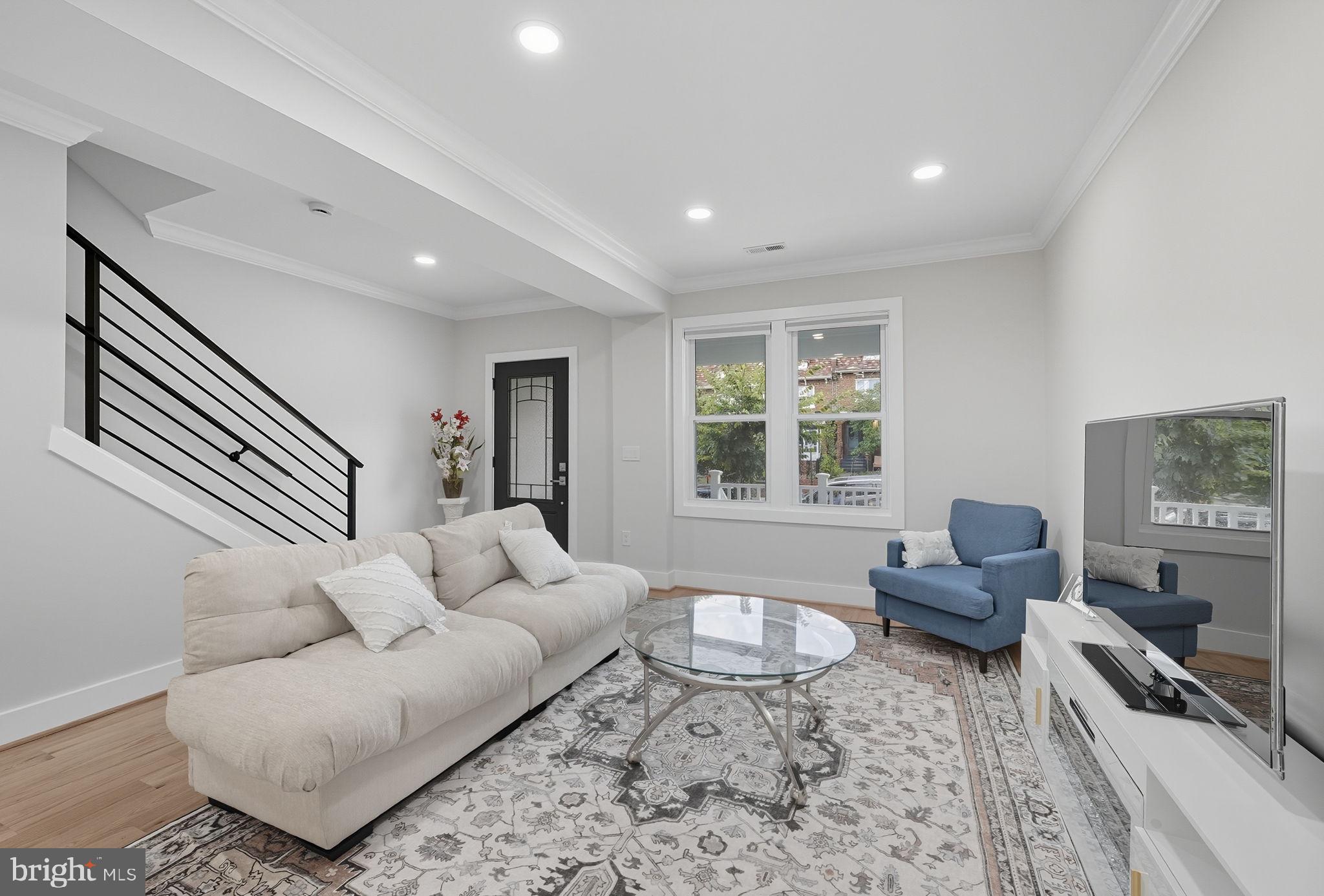 4902 4th Street Northwest Washington, DC 20011 - Photo 5 of 22 a living room with furniture and a window