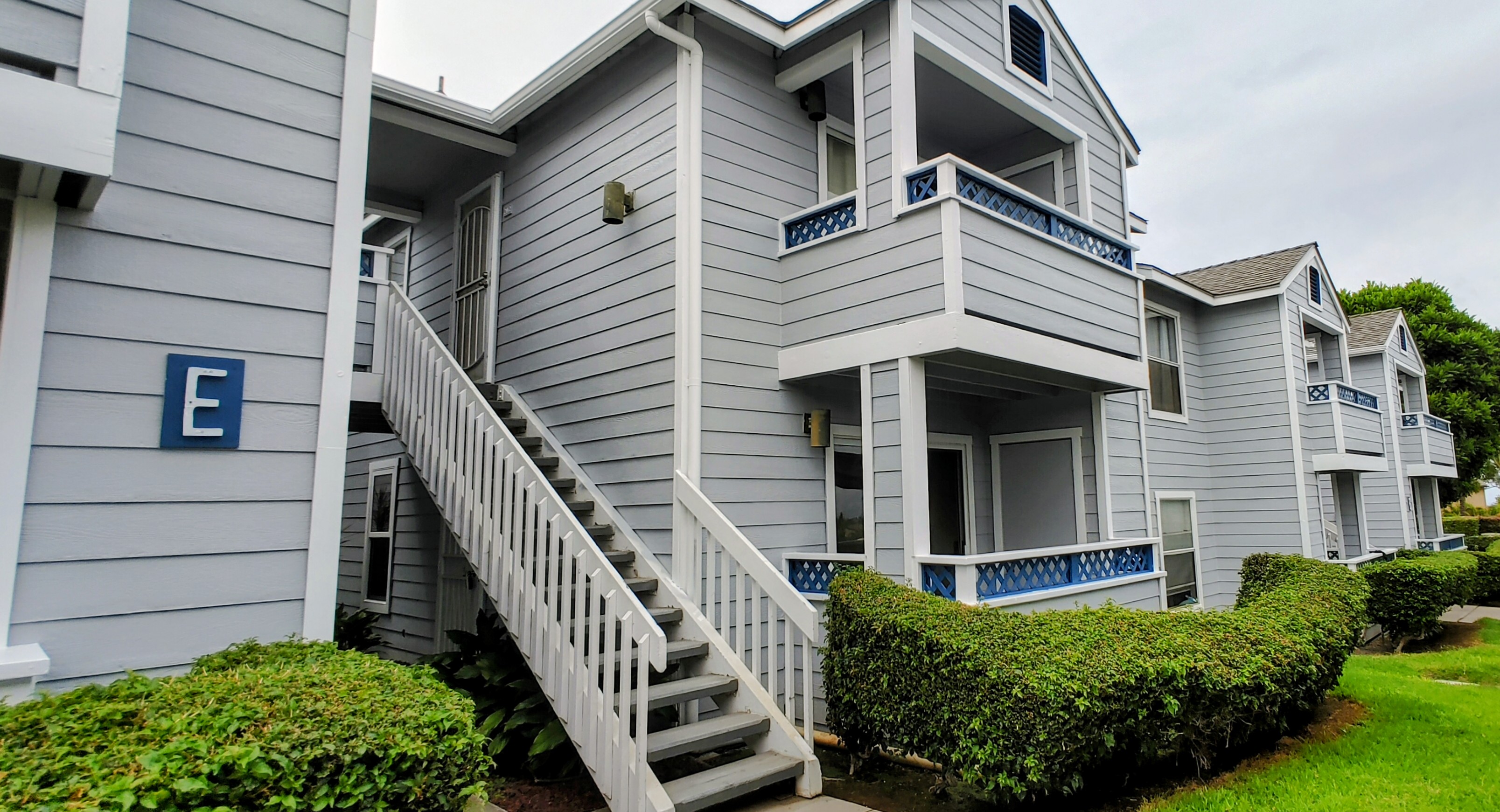 a view of a house with wooden stairs