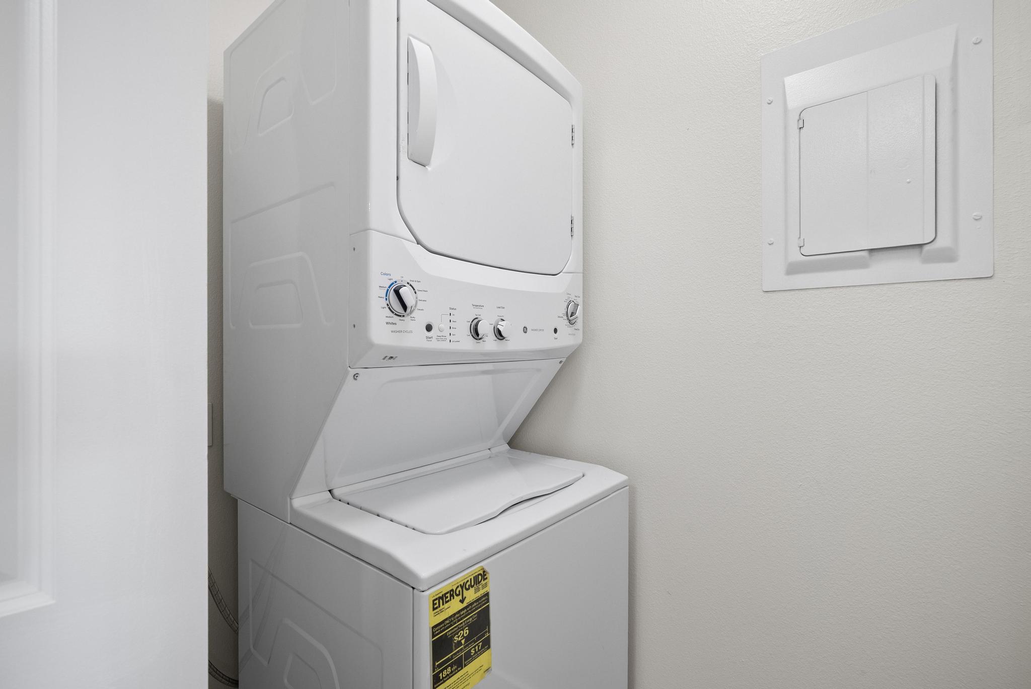 68-3831 Lua Kula Street, Unit E102 Waikoloa, HI 96738 - Photo 12 of 26 a utility room with dryer and washer