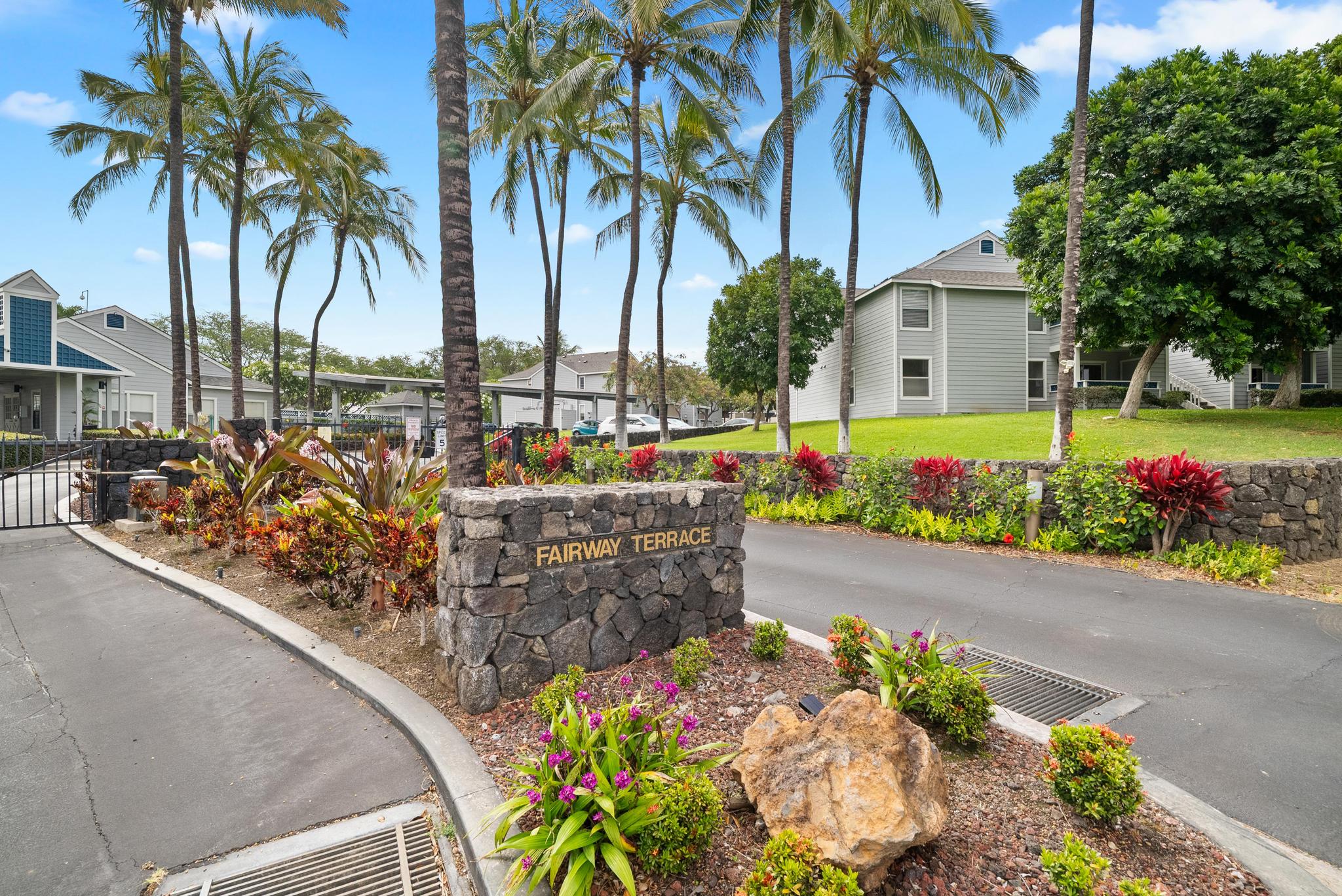 68-3831 Lua Kula Street, Unit E102 Waikoloa, HI 96738 - Photo 16 of 26 a view of a potted flower in a yard with swimming pool