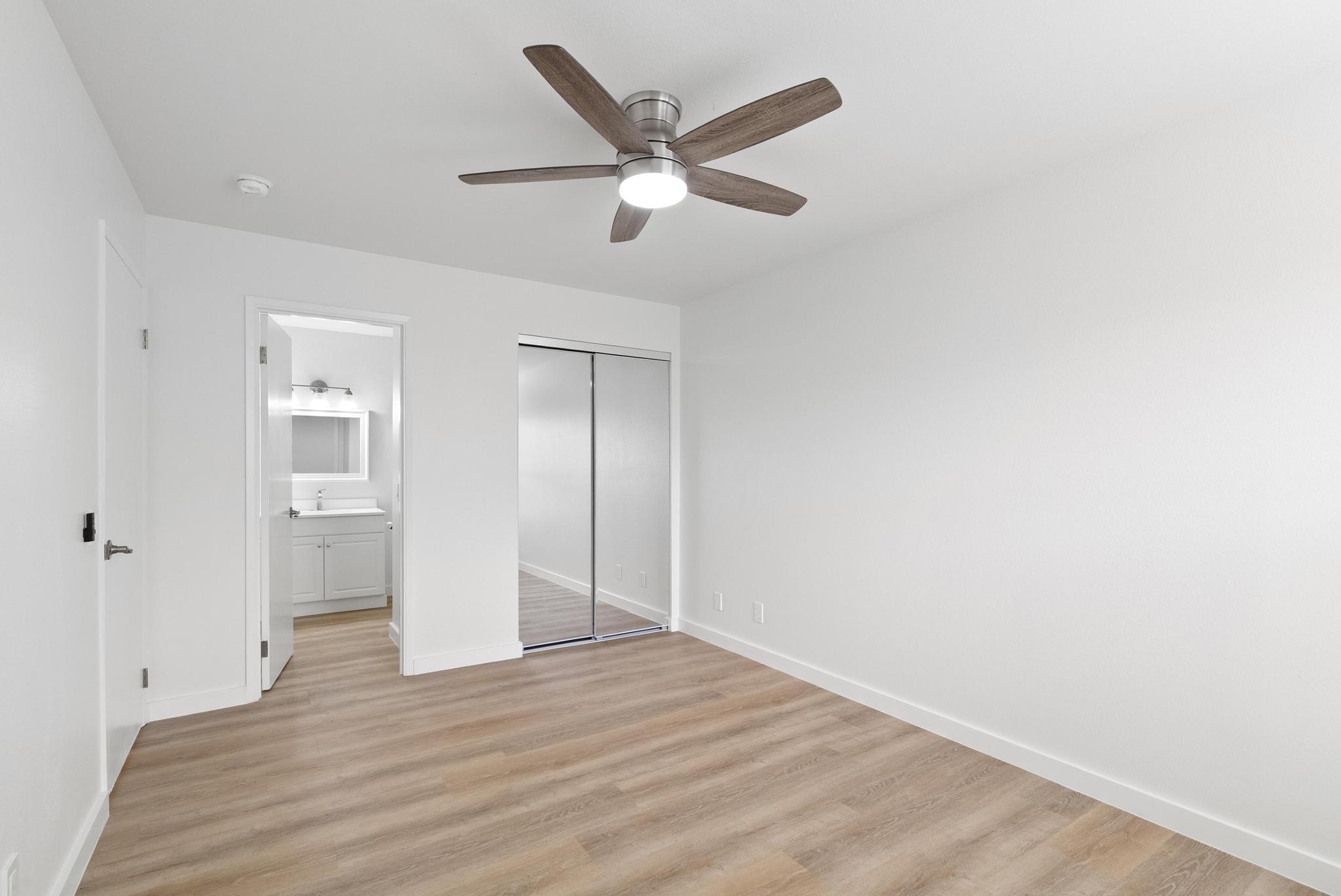 68-3831 Lua Kula Street, Unit E102 Waikoloa, HI 96738 - Photo 8 of 26 a view of an empty room with wooden floor