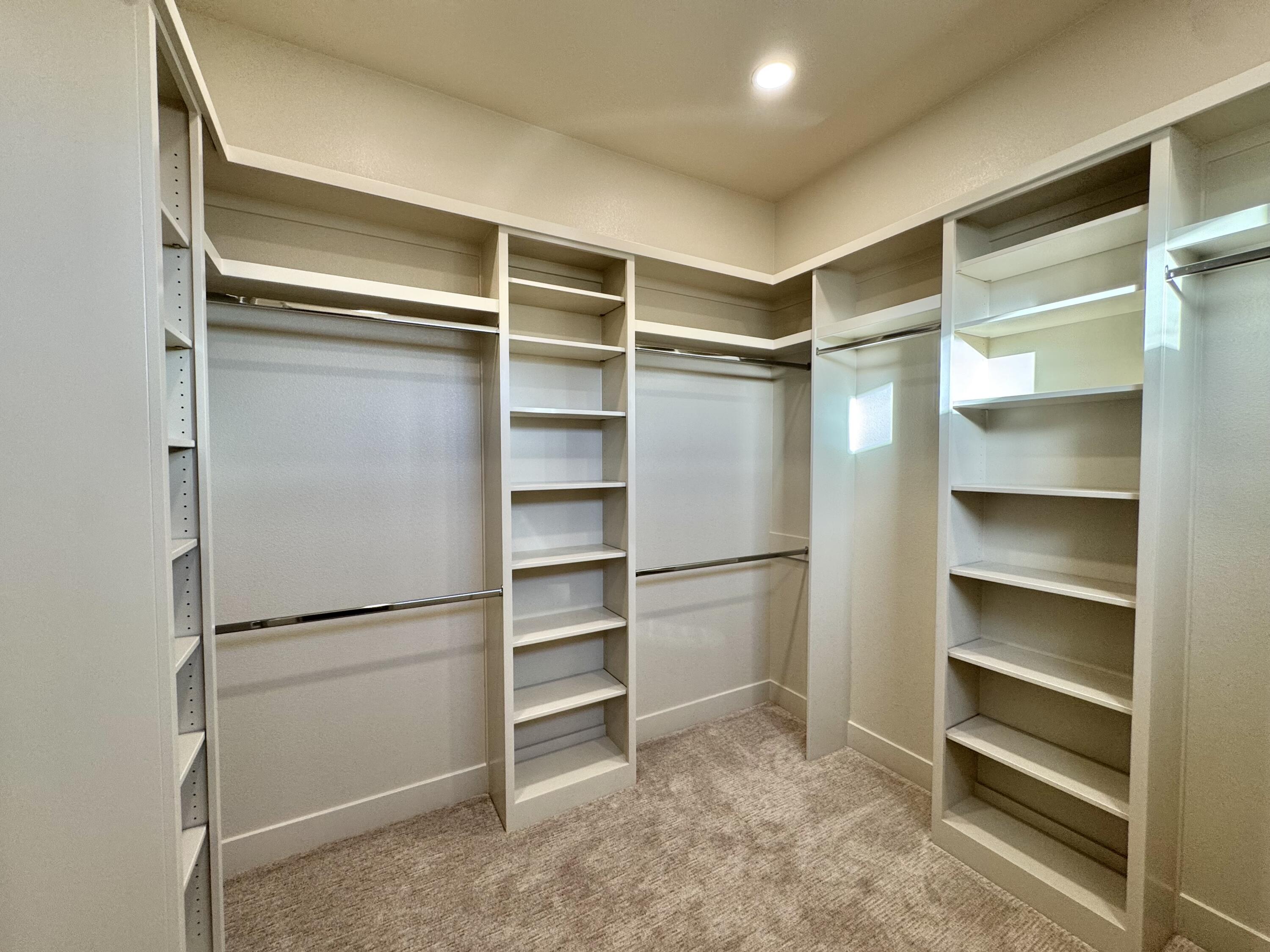 3613 143rd Street Lubbock, TX 79423 - Photo 28 of 44 a view of walk in closet with empty racks