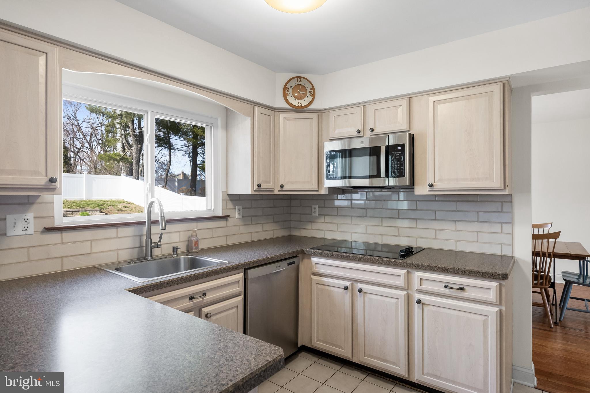508 Perry Drive Mount Laurel, NJ 08054 - Photo 13 of 61 a kitchen with cabinets stainless steel appliances a sink and a window
