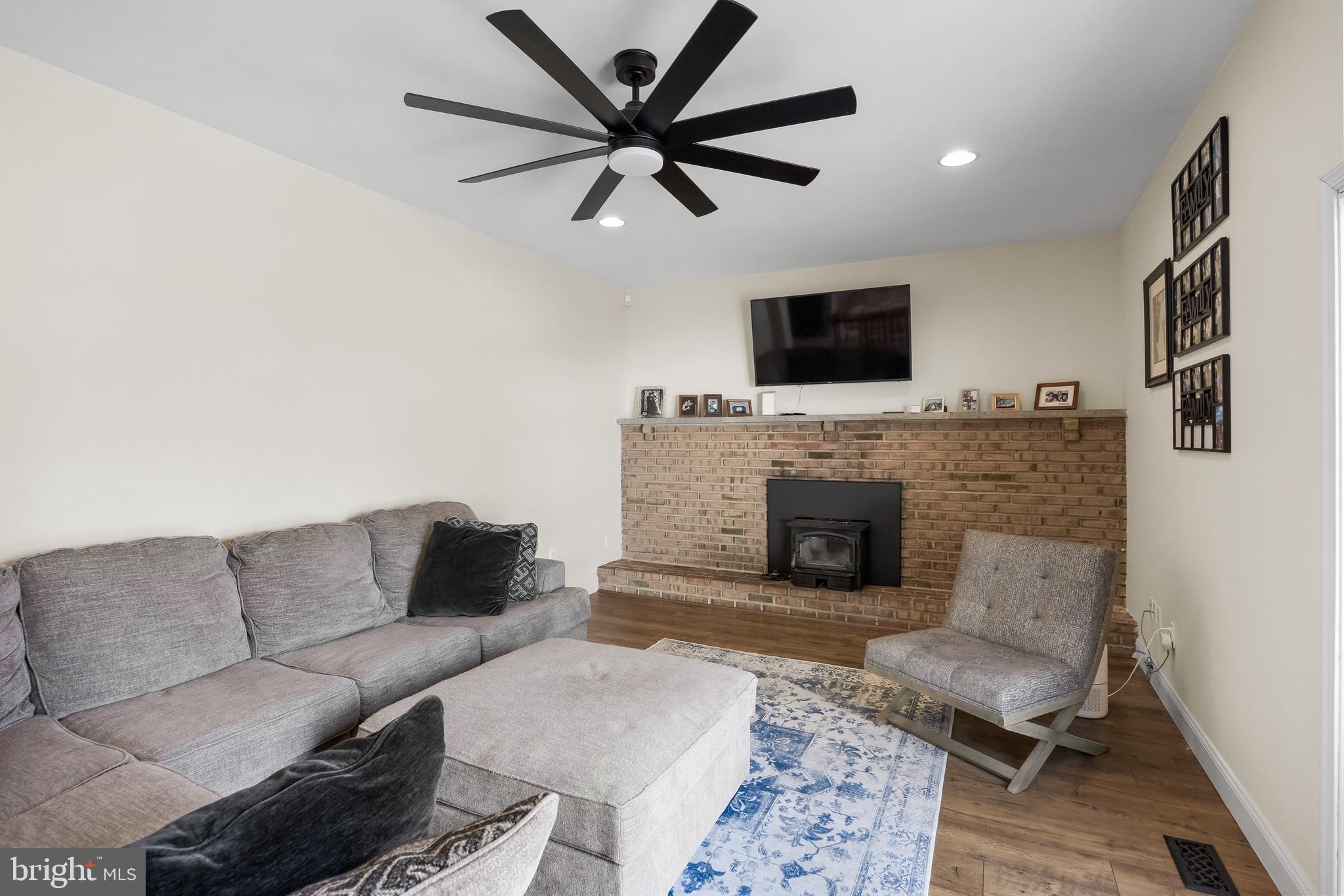 508 Perry Drive Mount Laurel, NJ 08054 - Photo 19 of 61 a living room with furniture a flat screen tv and a fireplace