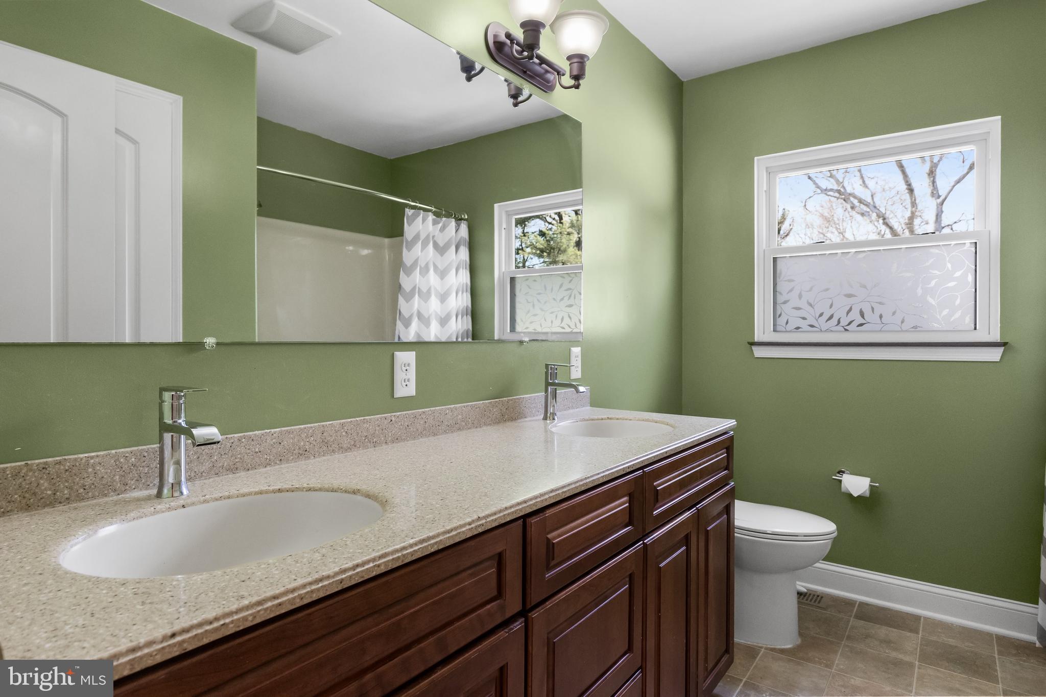 508 Perry Drive Mount Laurel, NJ 08054 - Photo 35 of 61 a bathroom with a granite countertop sink a toilet and mirror