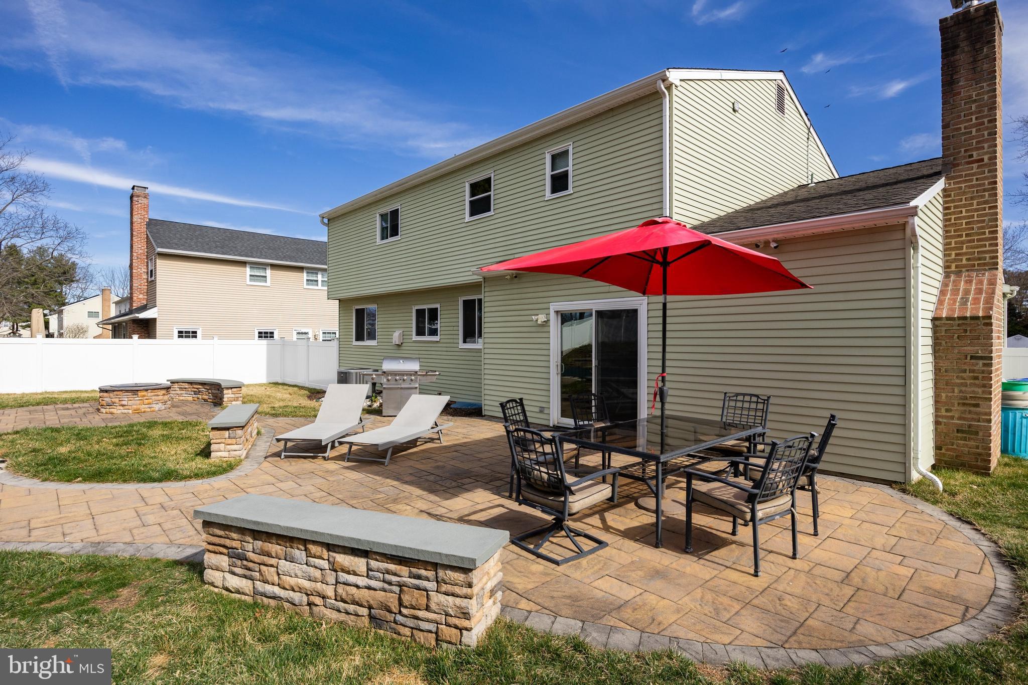 508 Perry Drive Mount Laurel, NJ 08054 - Photo 42 of 61 a view of a patio with table and chairs under an umbrella
