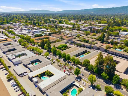 an aerial view of residential houses with outdoor space