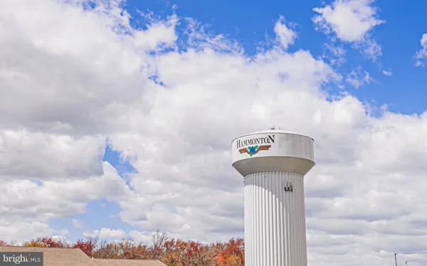 an aerial view of a house with a big yard and large trees