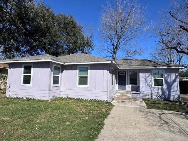 a front view of a house with yard