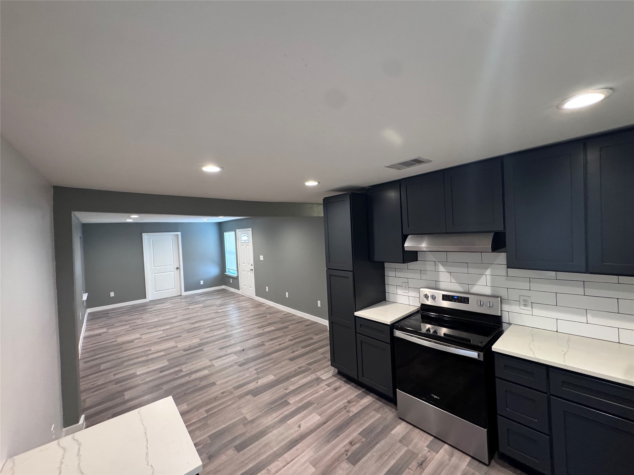 4529 Dewberry Street Houston, TX 77021 - Photo 3 of 10 a kitchen with a sink stove and cabinets